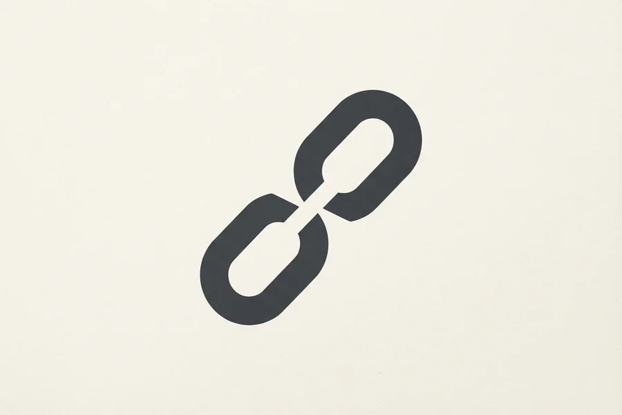 A dark broken chain, split apart at its middle link.